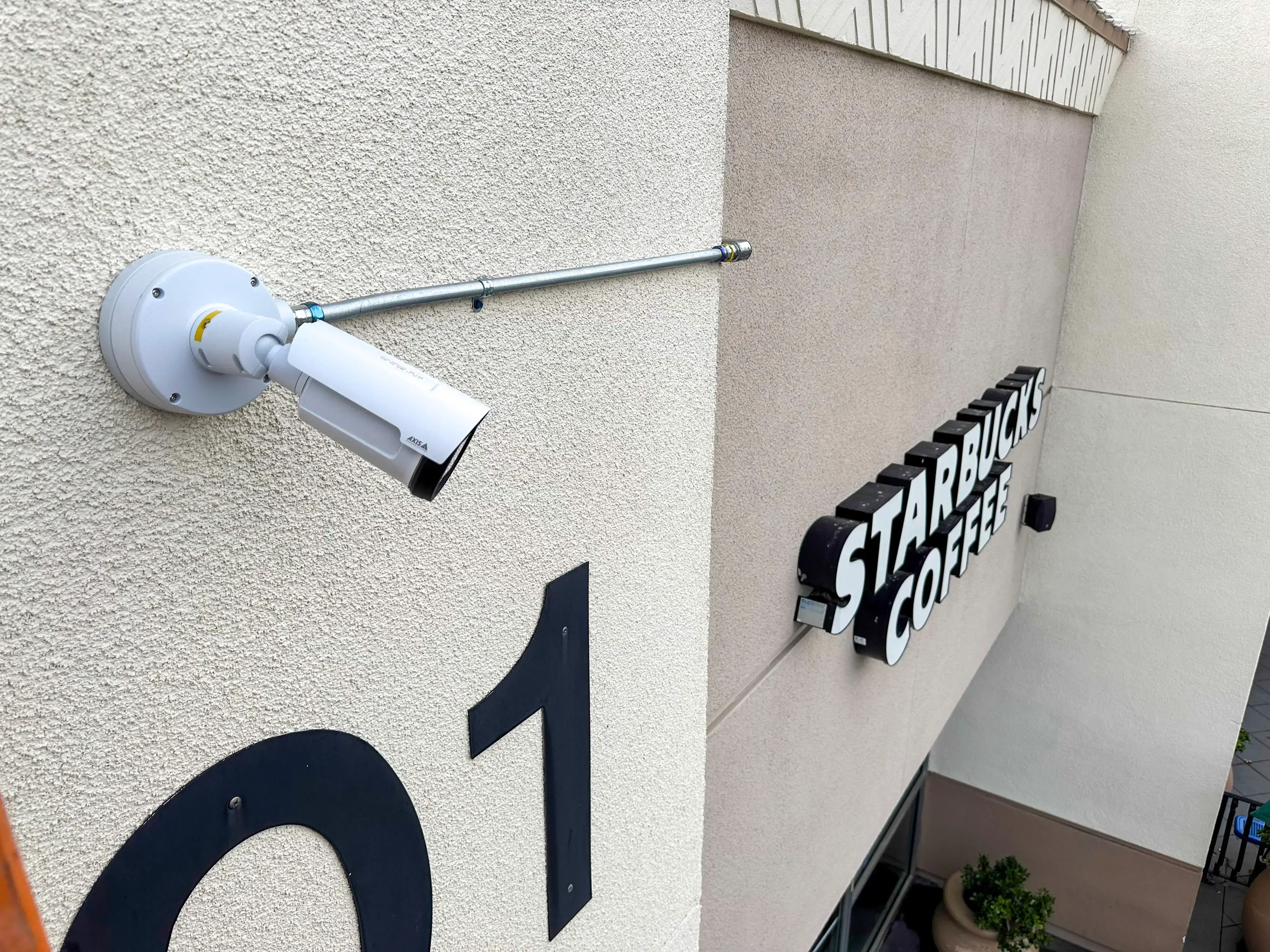 Peninsula shopping center surveillance and LPR camera installation by Proava Tech - AXIS IP cameras, multi-building network photo 1